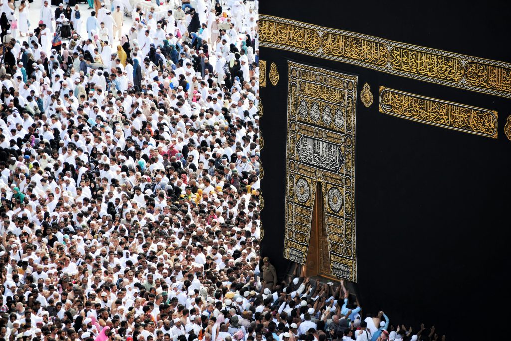 Large group of pilgrims gathered around the Holy Kaaba in Makkah
