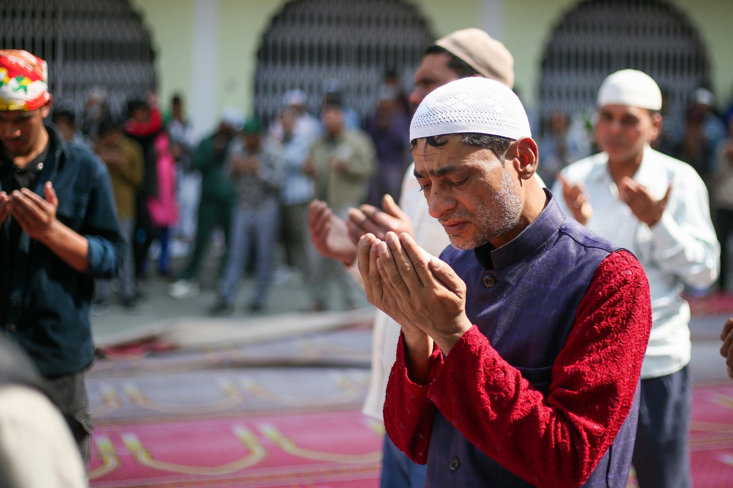 Muslim man performing dua during prayer