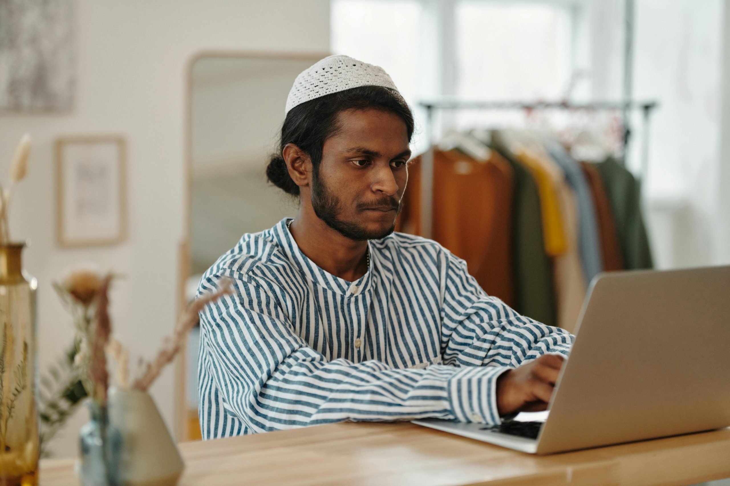 Man planning travel and booking services online using laptop