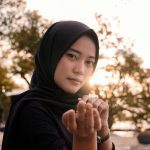 Muslim woman enjoying travel experience outdoors