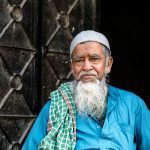 Portrait of an elderly Muslim man with traditional attire