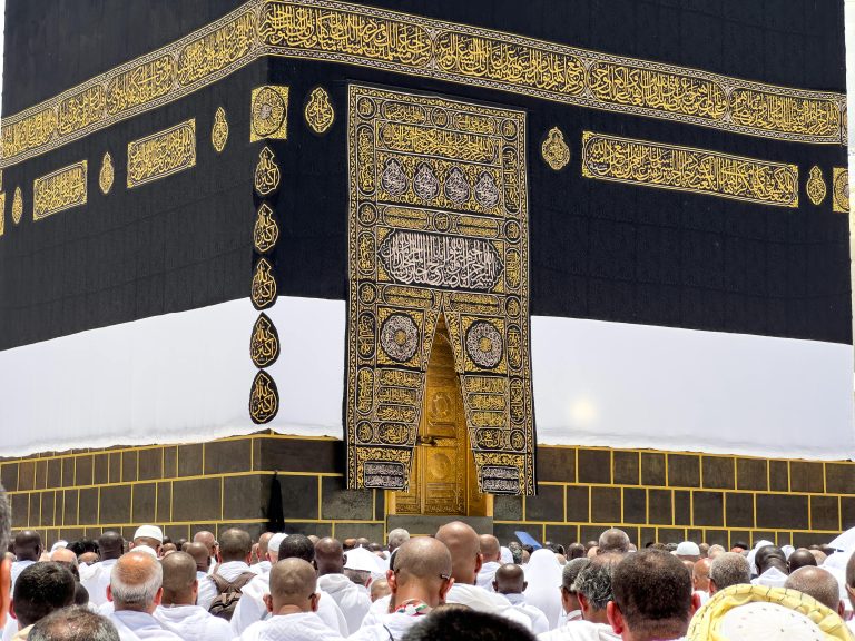 Hajj and Umrah travel services supporting pilgrims during pilgrimage at the Kaaba in Makkah