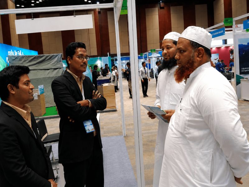 Al Muzammil team discussing travel arrangements with international tour operators