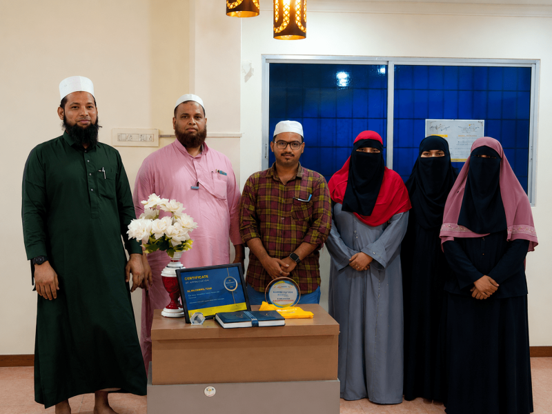 Al Muzammil Haj Umrah Group team members serving pilgrims and travellers